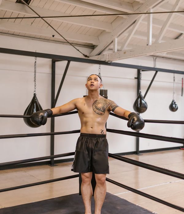 Man in a calm, powerful stance, ready for strength practice.